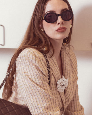 Accessories available at vintage and designer consignment shop "Decades" in Los Angeles and features a pair of women's Chanel sunglasses.