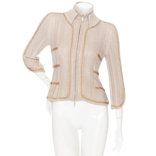 Resale beige and gold chain cardigan by Chanel in Size FR 40. Available for purchase online and in store at Decades Los Angeles.