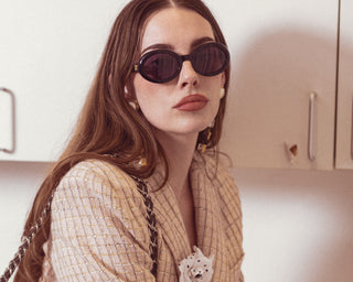 Accessories available at vintage and designer consignment shop "Decades" in Los Angeles and features a pair of women's Chanel sunglasses.