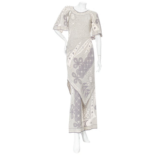 Preowned 1960s gray and white silk printed two-piece dress and pants set by Chanel in vintage 10, an approximate contemporary size 4 or small, in great vintage condition, with a few stains consistent with age. Available for purchase online and in store at decades los angeles.