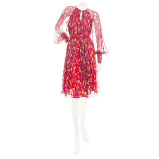 A vintage red floral print silk A-line dress from the 1970s in a Size Small/Medium available at designer and vintage specialty shop "Decades" in Los Angeles.
